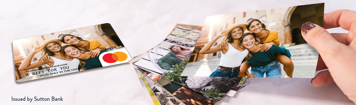 Gift card with a photo of smiling people alongside printed photographs.