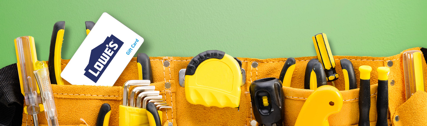 A tool belt with various tools and a Lowe's gift card against a green background.